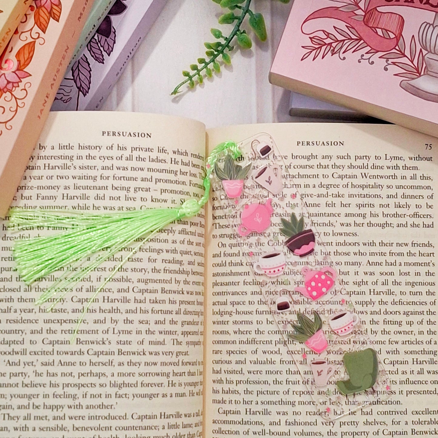 Botanical tea and plants bookmark for readers on an open book page.