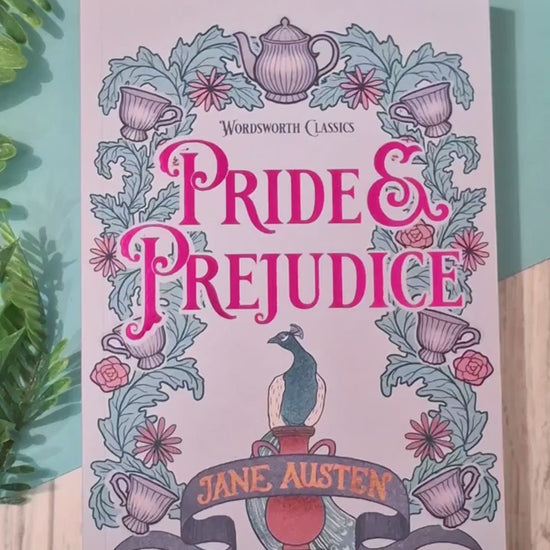 Short video showing a Tea and Plants acrylic bookmark with tassel being removed from its packaging, held up close to the camera to highlight the intricate tea and botanical design, then placed between the pages of a book to demonstrate how it works as a decorative reading bookmark.