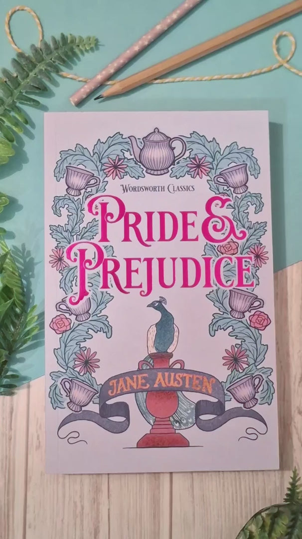 Short video showing a Tea and Plants acrylic bookmark with tassel being removed from its packaging, held up close to the camera to highlight the intricate tea and botanical design, then placed between the pages of a book to demonstrate how it works as a decorative reading bookmark.