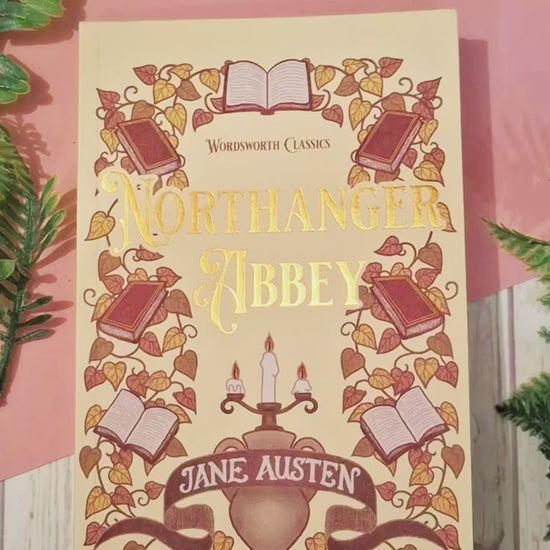 Short video showing a Morning Coffee acrylic bookmark with tassel being removed from its packaging, held up close to the camera to highlight the intricate coffee cup design, then placed between the pages of a book to demonstrate how it works as a decorative reading bookmark.